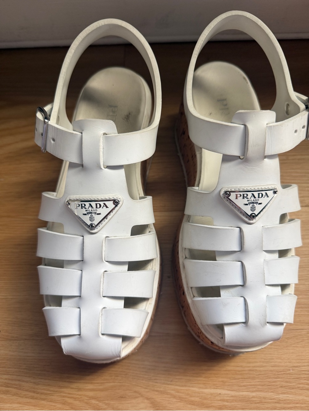 Prada Monolith Platform Fisherman Sandals in white with cork platform sole